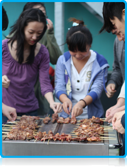 Chinese students at WUAS cooking lamb kebabs August 2012