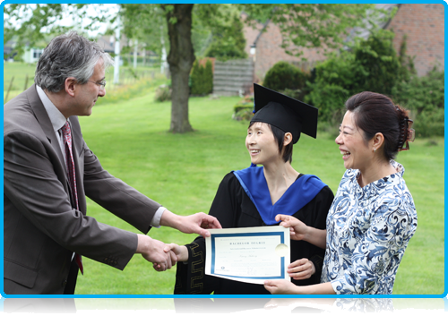 Debbie 19th May 2012, receives her degree from Peter Birdsall and Maggie Feng